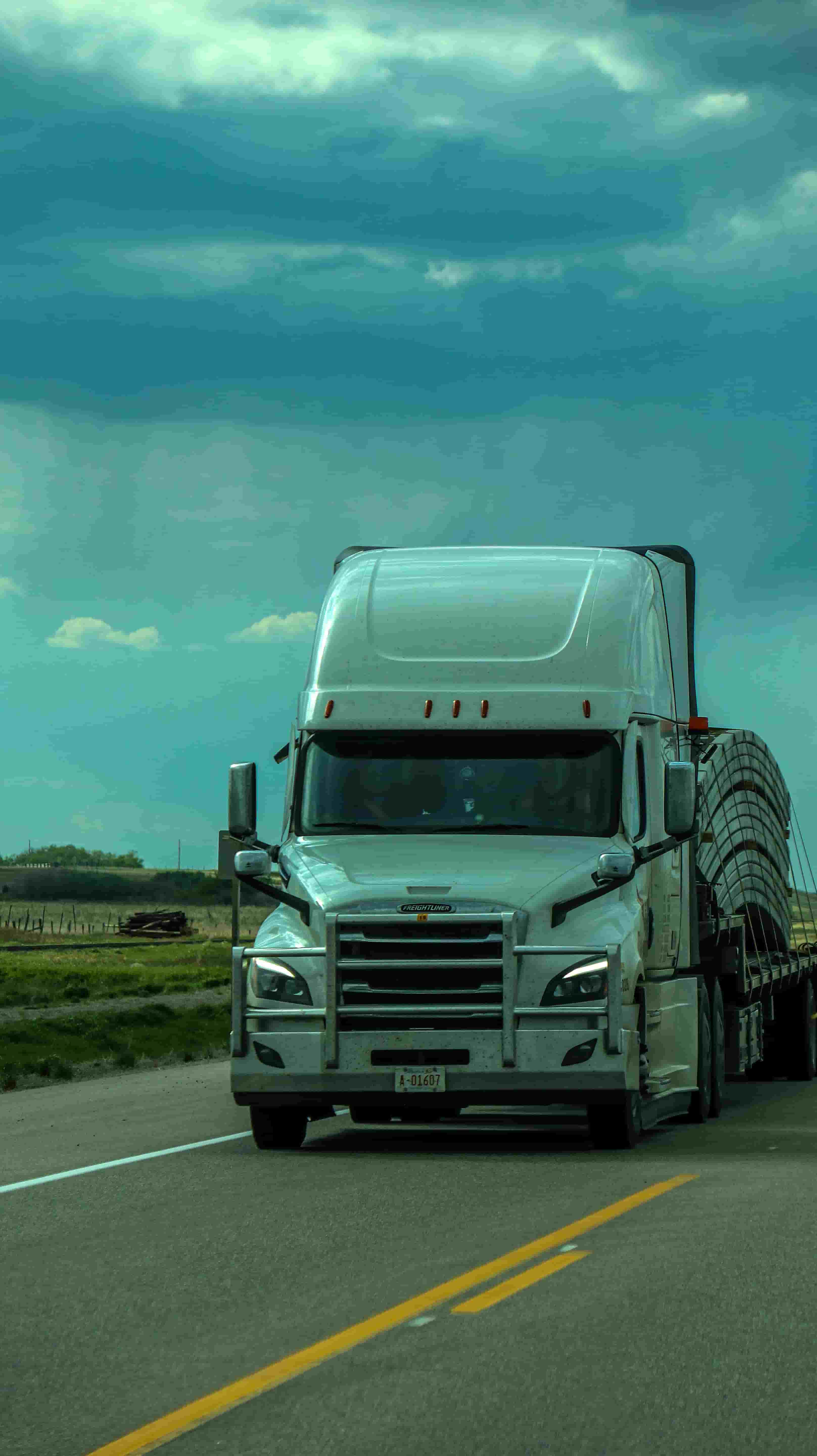 Semi truck hauling freight on the highway serving Harrisburg, Pennsylvania