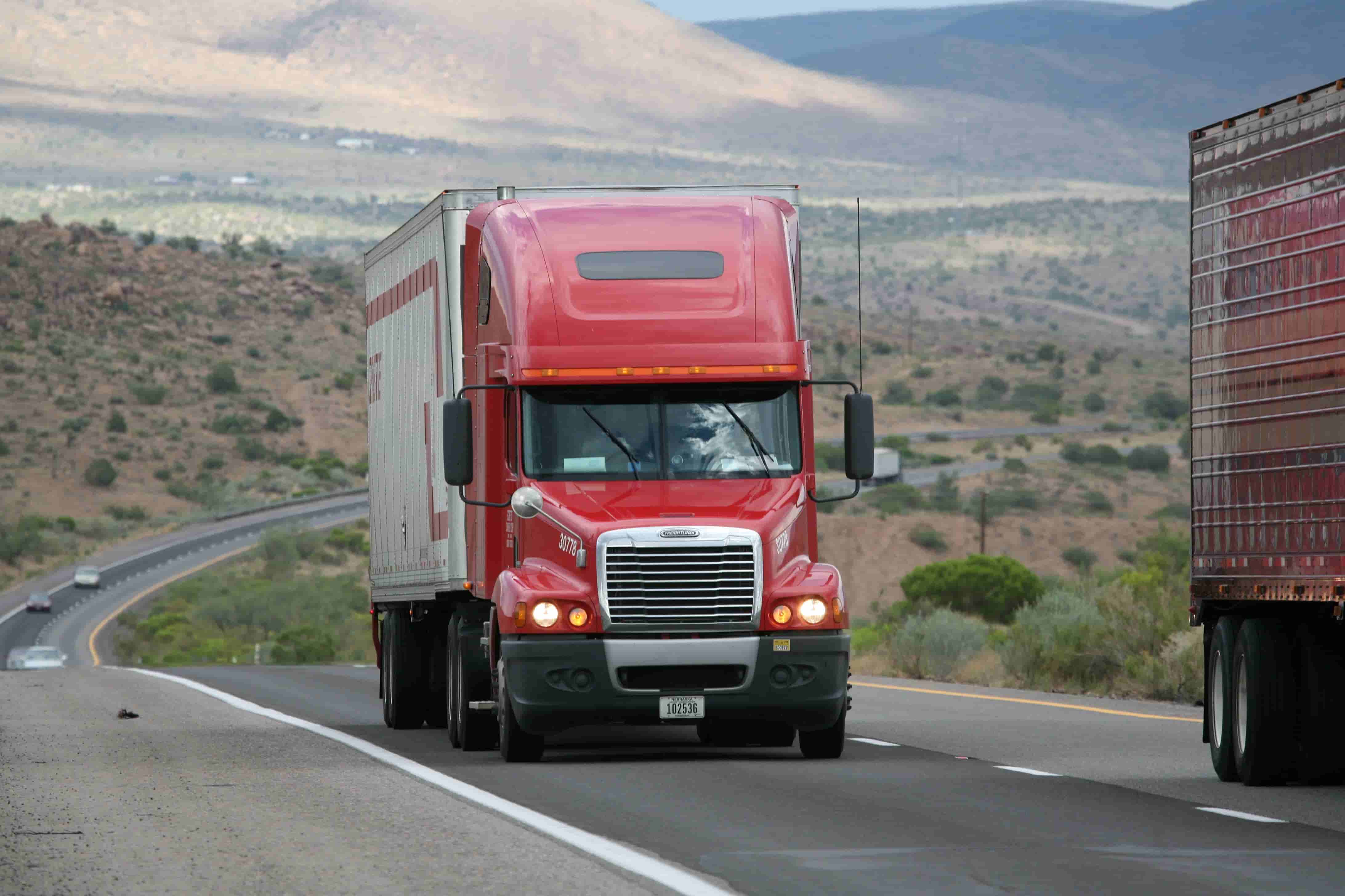 Commercial semi truck hauling freight on the interstate corridor serving Harrisburg, PA