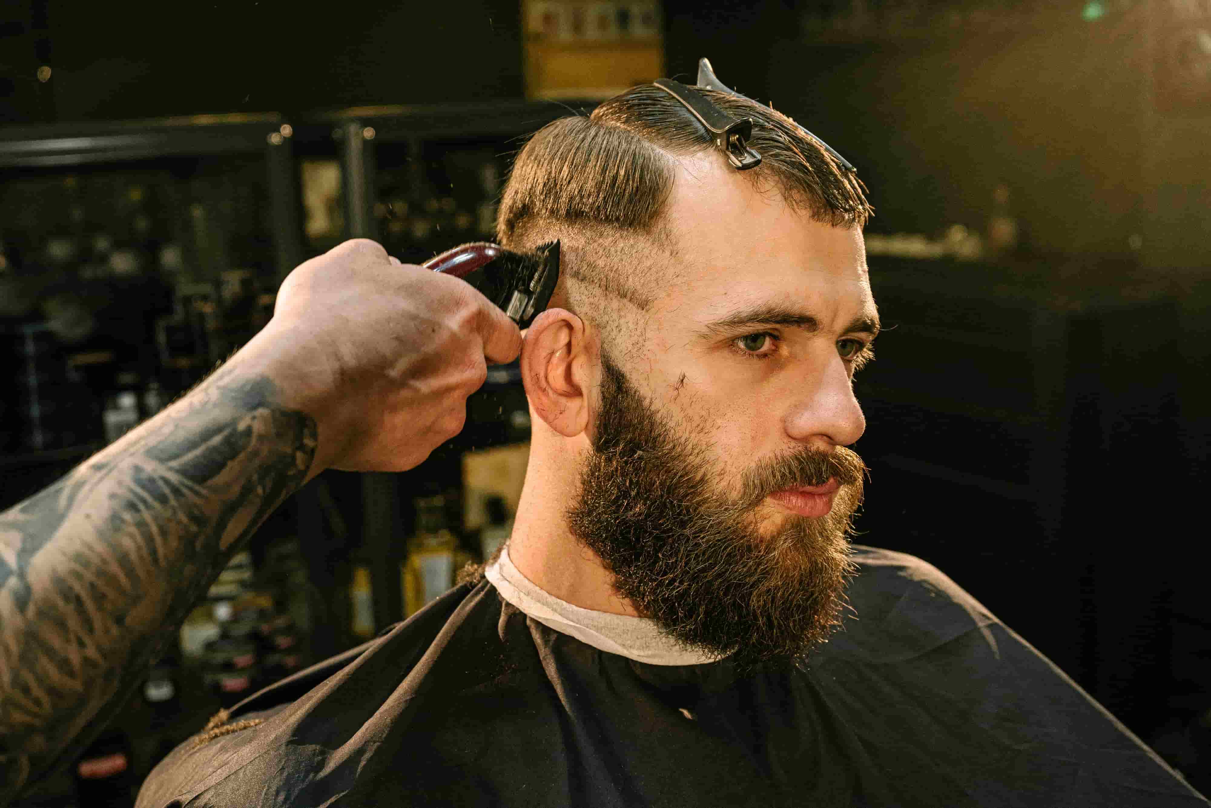 Barber cutting a client's hair in a Pennsylvania barbershop