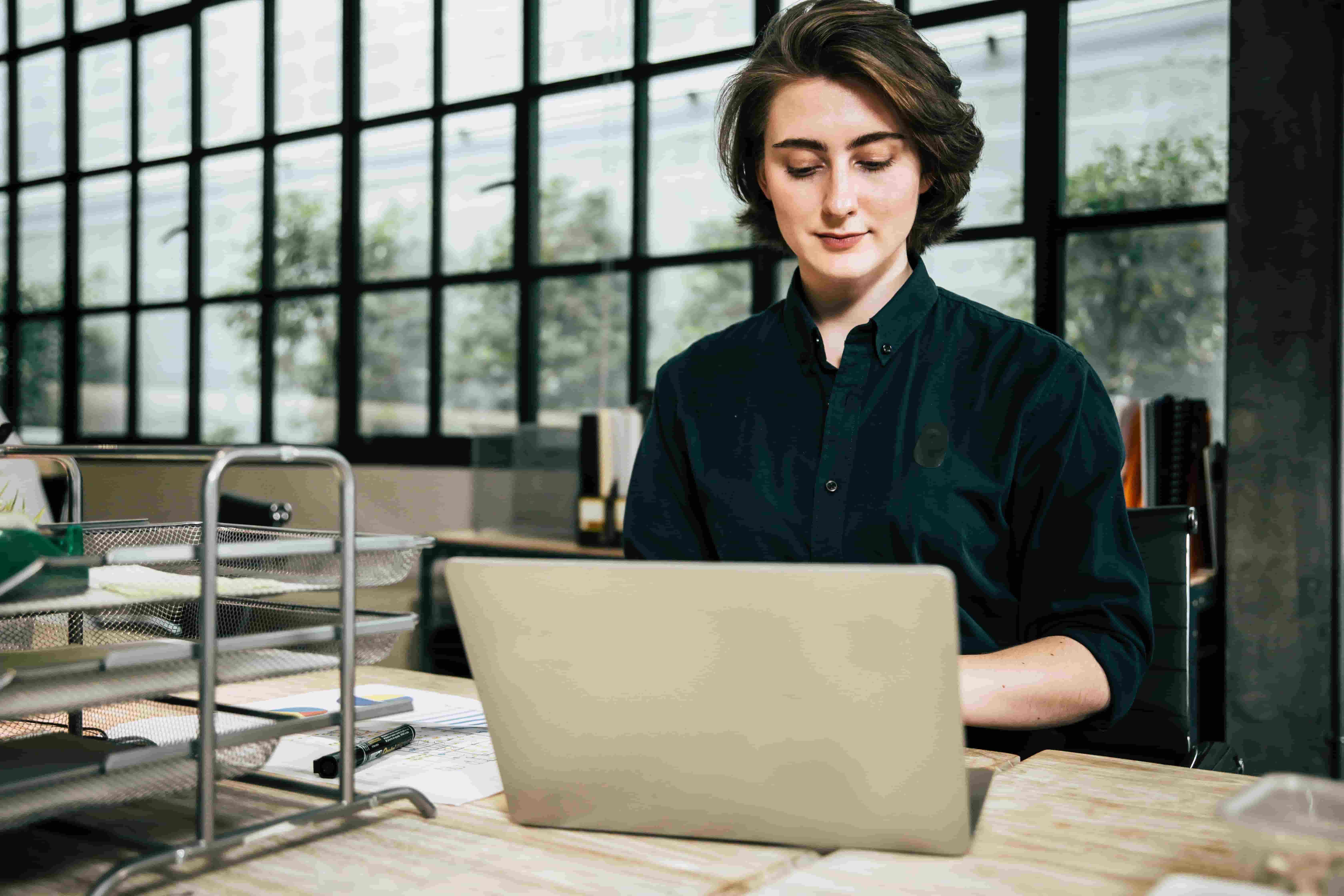 Business owner working on a laptop at a desk