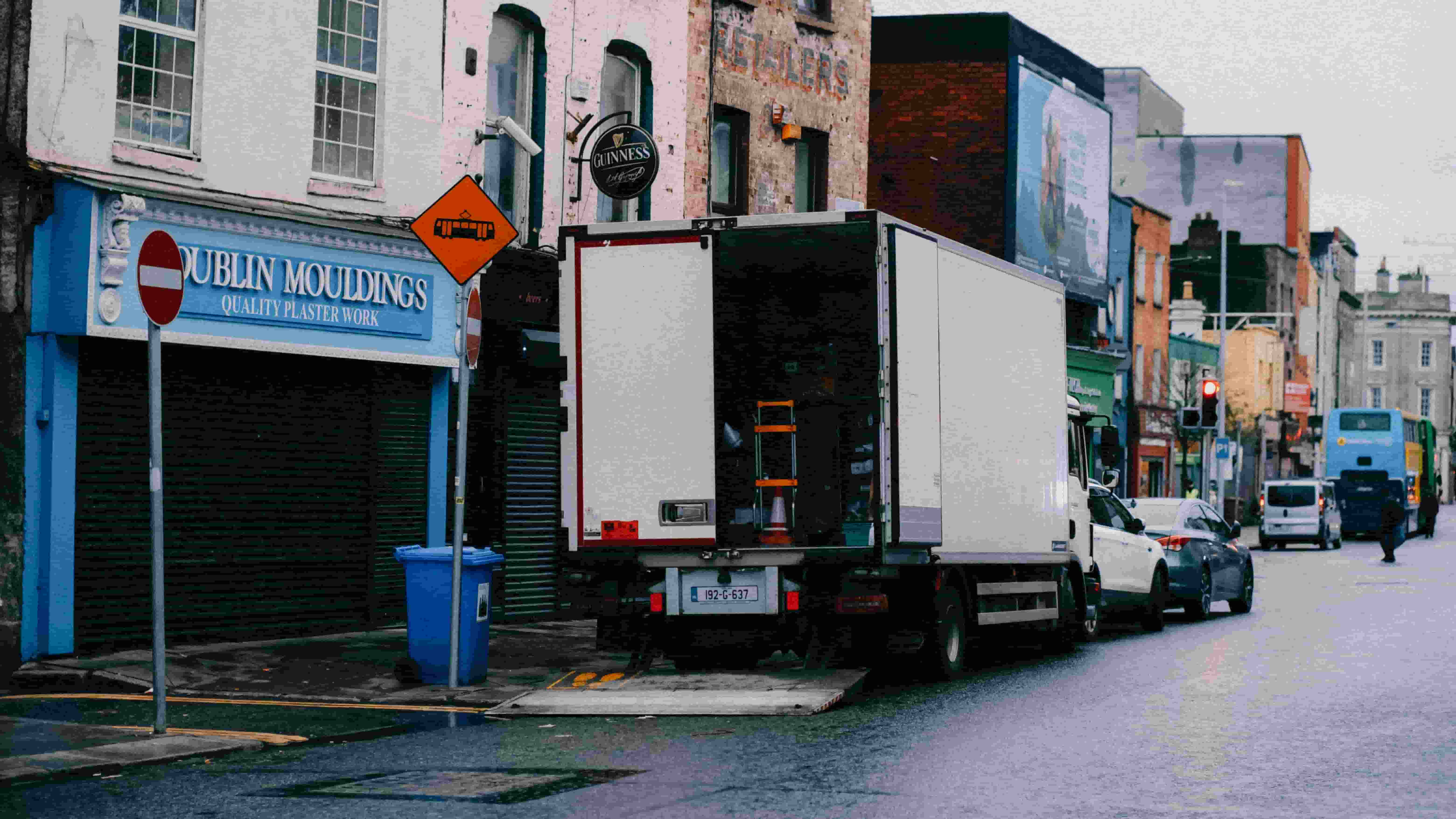 Box truck making a delivery on a city street