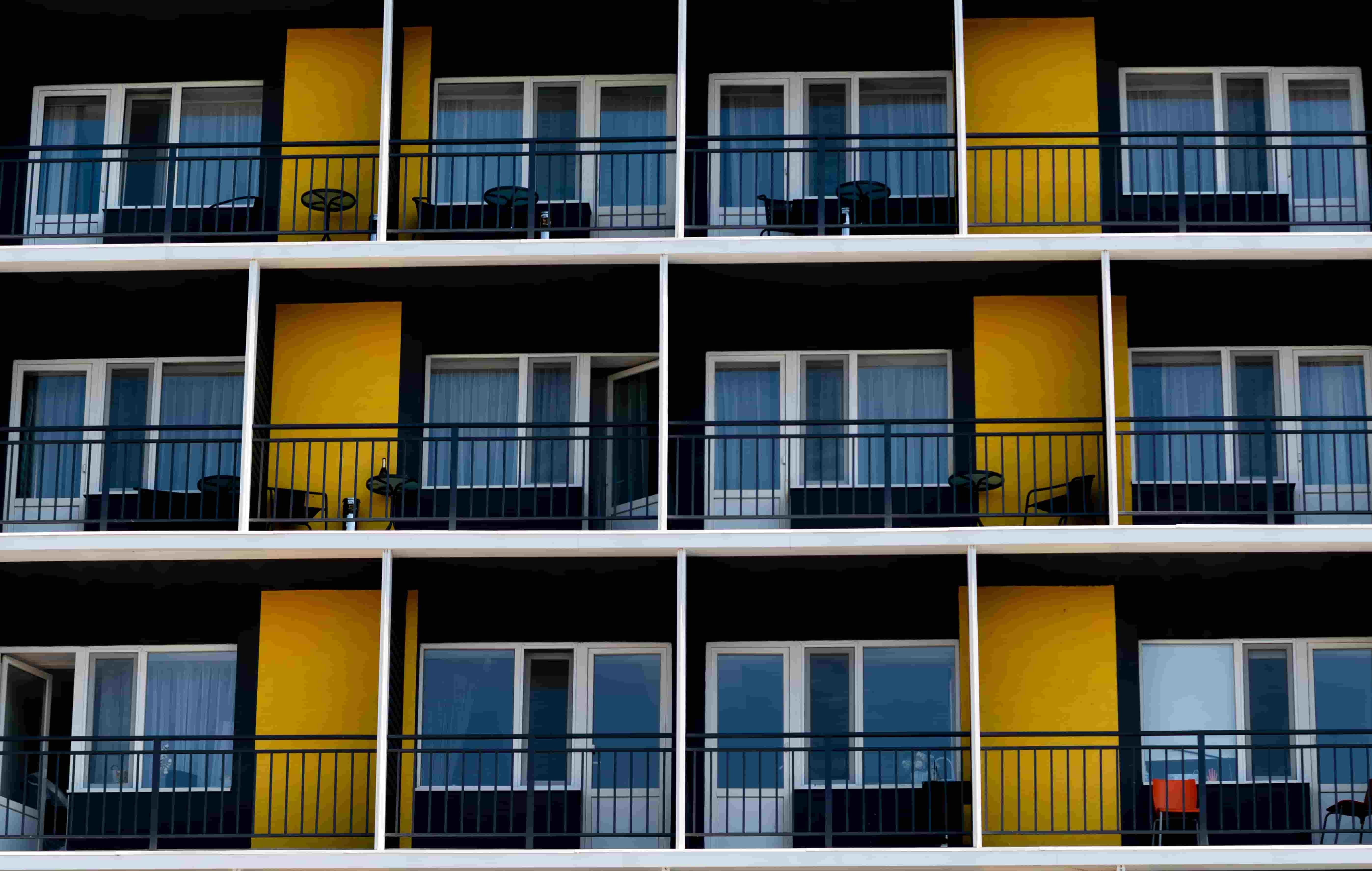 Aerial view of a condominium complex with private balconies