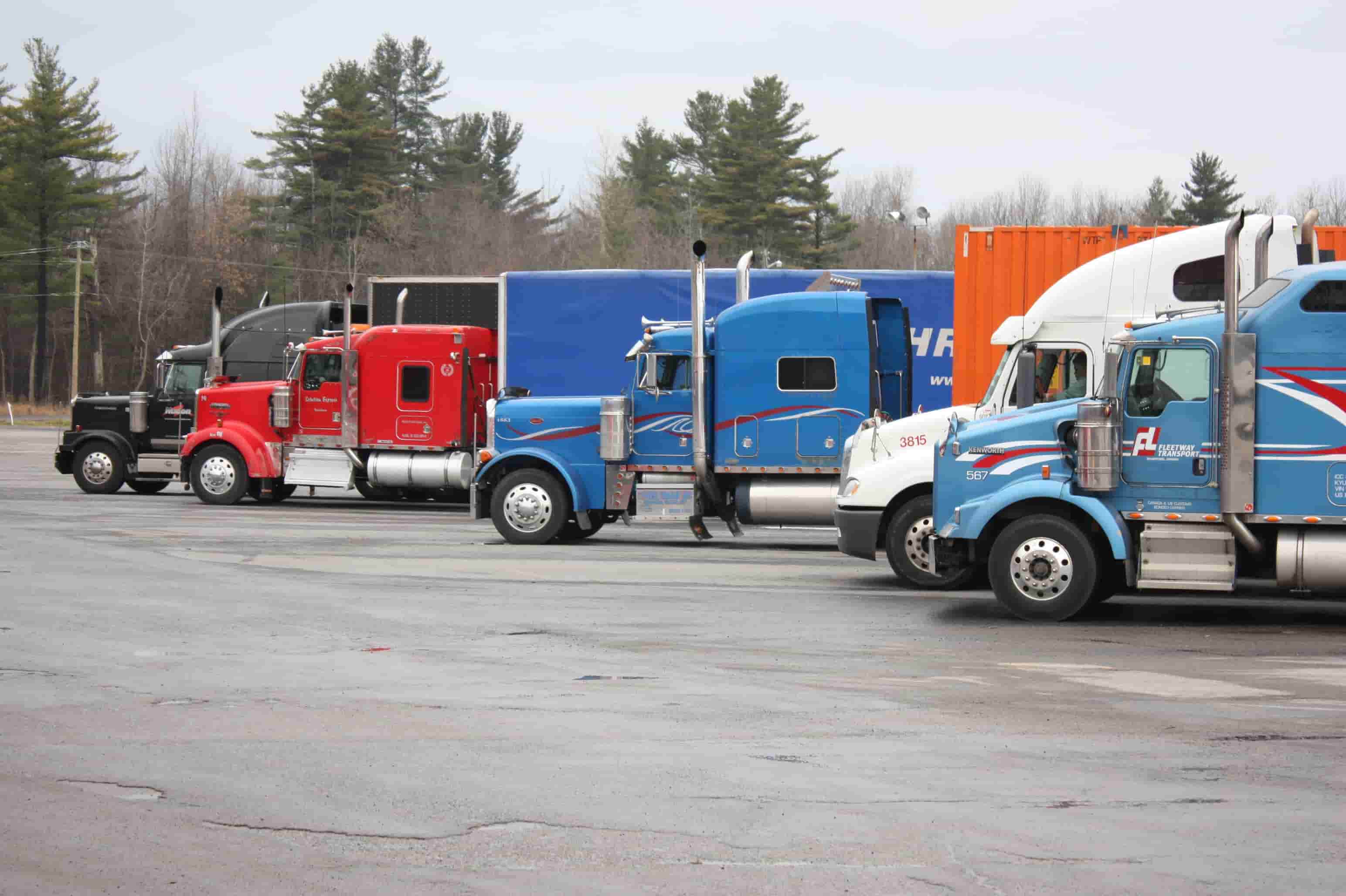 Line of commercial trucks parked at a truck stop near Harrisburg, Pennsylvania